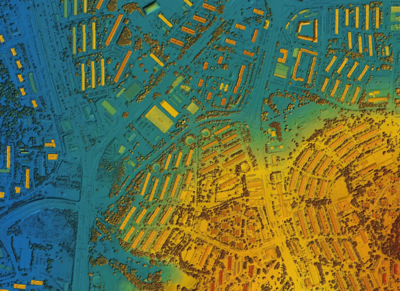 A LiDAR surface model of a residential district with roofs trees and terrain color ramped by elevation